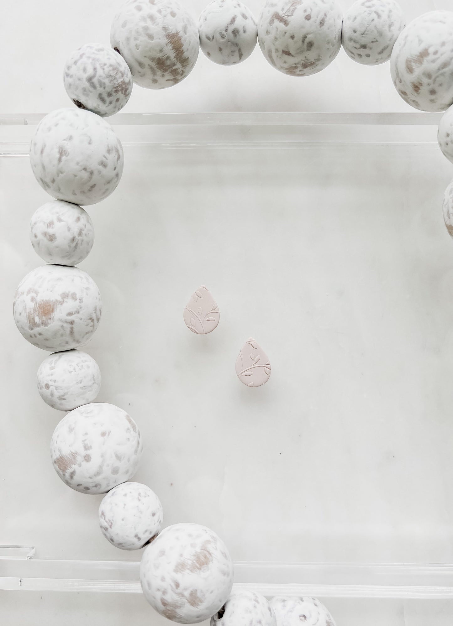 Neutral Teardrop Studs